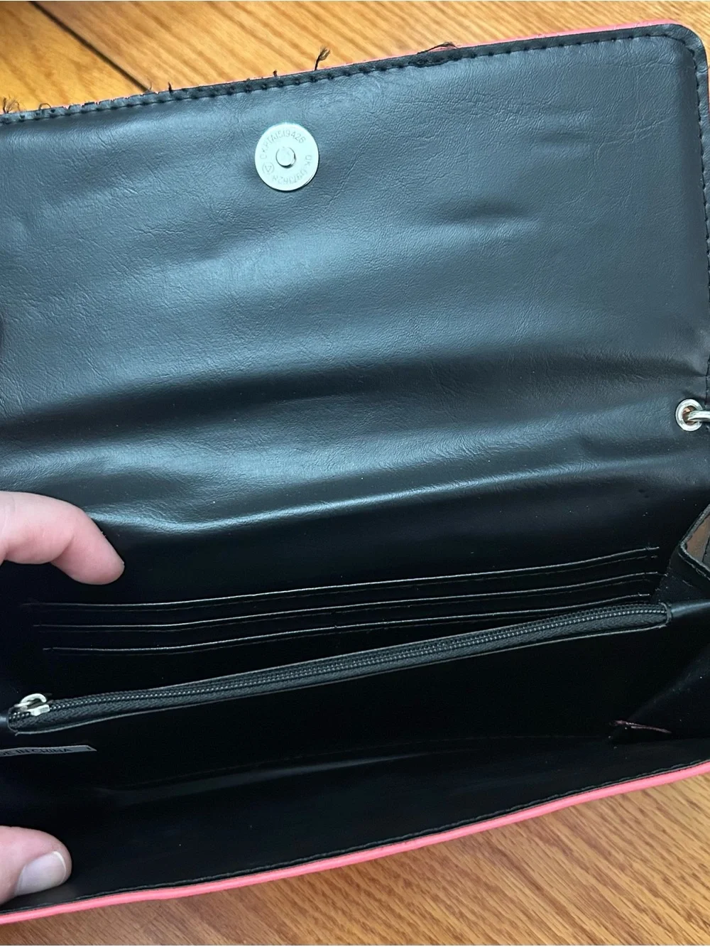 Pink wallet purse with shoulder strap and clasp